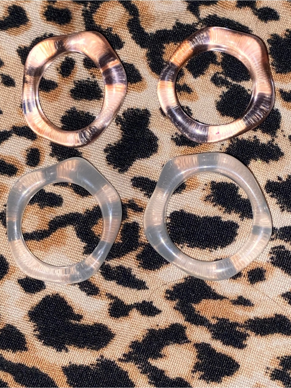 2 clear/white and 2 light pink acrylic rings